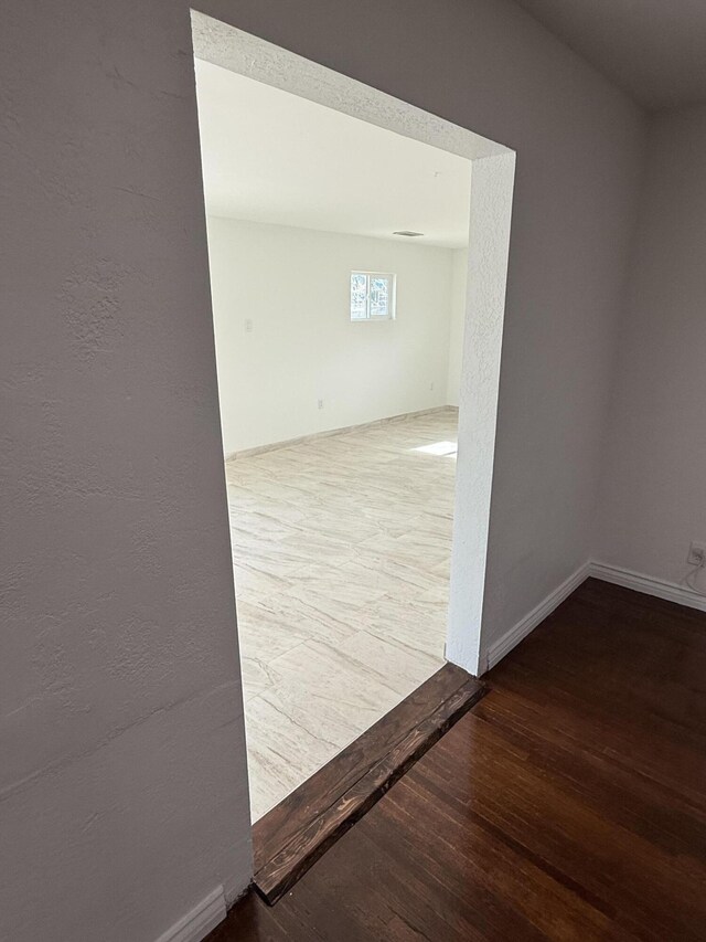 empty room featuring hardwood / wood-style floors