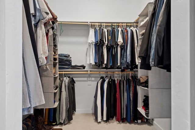 walk in closet featuring carpet