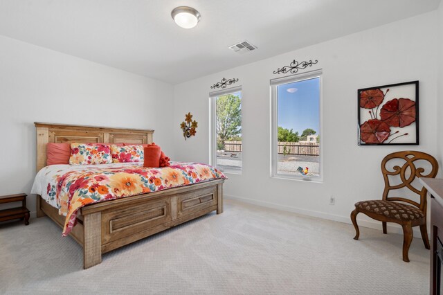 70 Camino De Claudio, Corrales, NM 87048 - bedroom with visible vents, baseboards, and light colored carpet