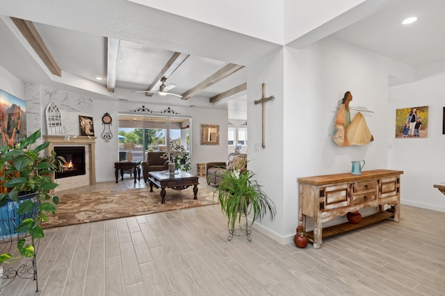 interior space featuring beam ceiling and light hardwood / wood-style floors