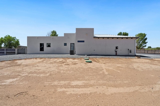 rear view of house with cooling unit