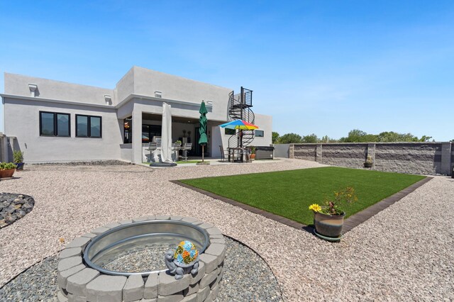70 Camino De Claudio, Corrales, NM 87048 - back of house with a patio area, fence, a yard, and stucco siding