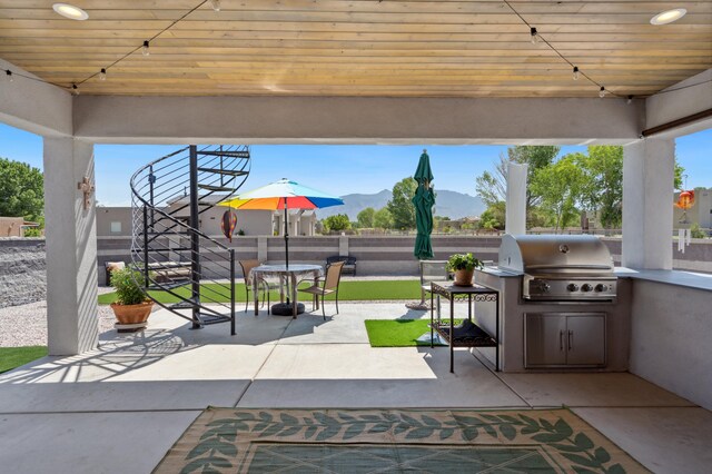 70 Camino De Claudio, Corrales, NM 87048 - view of patio / terrace with area for grilling, an outdoor kitchen, fence, a gazebo, and outdoor dining space