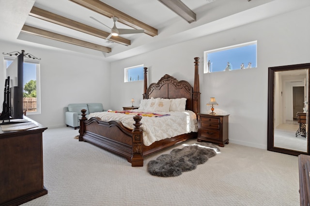 carpeted bedroom featuring ceiling fan and beam ceiling