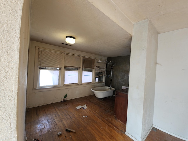 bathroom with hardwood / wood-style floors