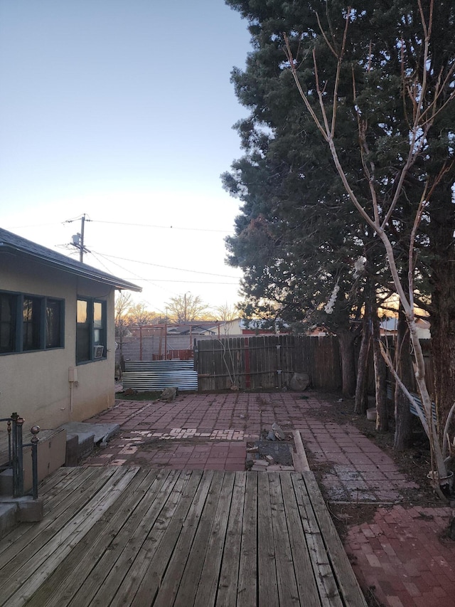 wooden terrace featuring a patio