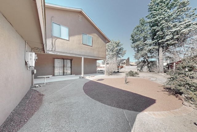 back of house featuring a patio