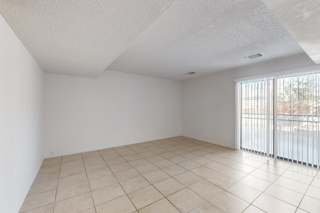 empty room featuring light tile patterned floors