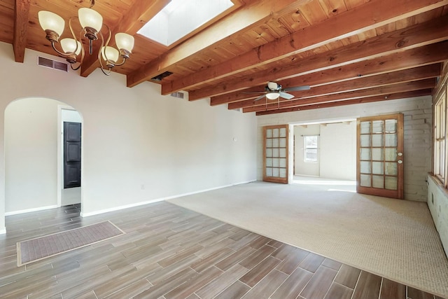 unfurnished living room featuring hardwood / wood-style floors, ceiling fan with notable chandelier, wooden ceiling, and beam ceiling