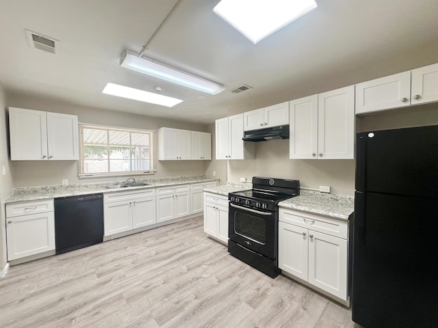 kitchen with black appliances, visible vents, under cabinet range hood, and white cabinetry