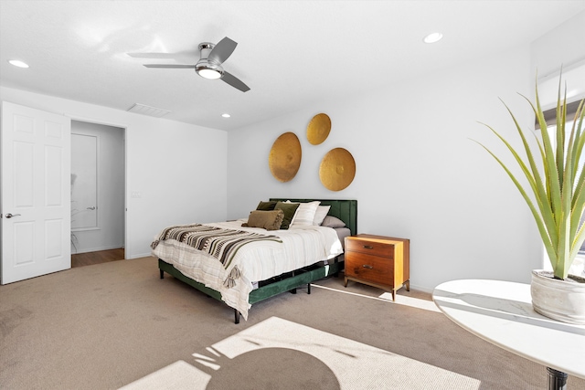 bedroom with light carpet and ceiling fan