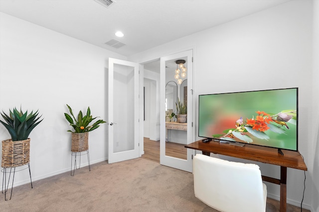 carpeted office with french doors