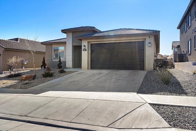 prairie-style home featuring a garage