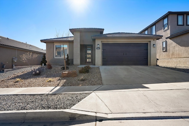 prairie-style home featuring a garage