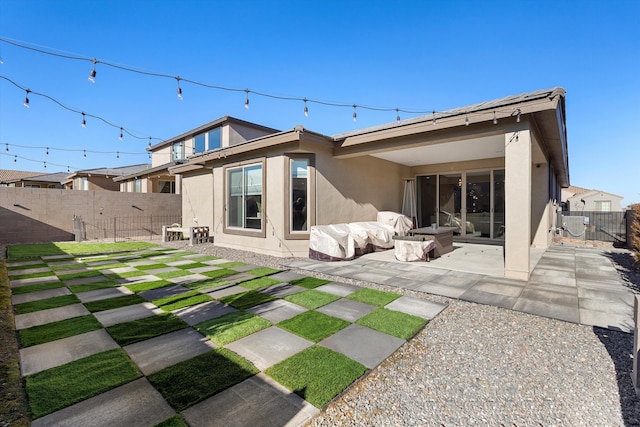 rear view of property with a patio area