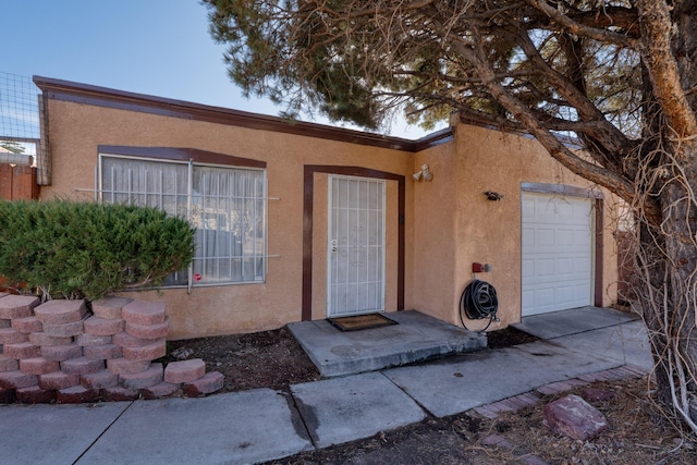 entrance to property featuring a garage