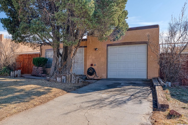 ranch-style house featuring a garage