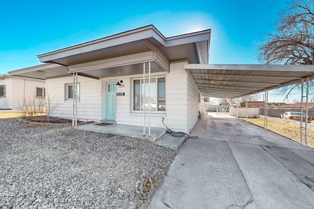 view of front facade with a carport