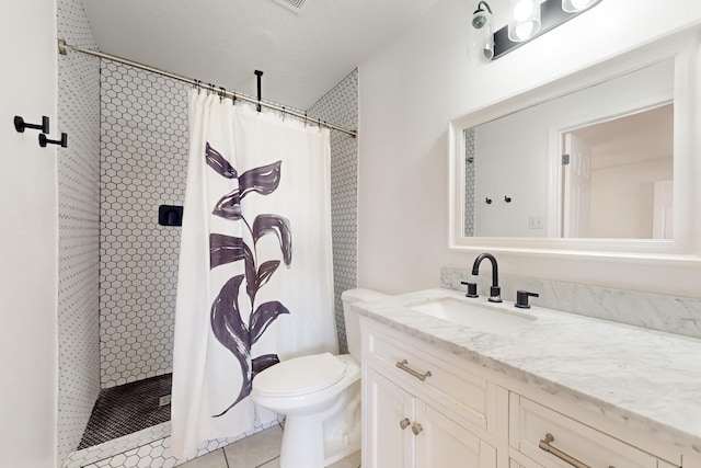 bathroom featuring vanity, toilet, tile patterned flooring, and a shower with shower curtain