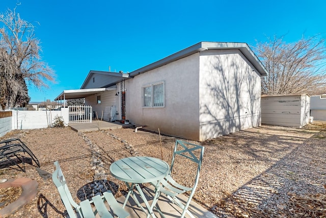 rear view of property featuring a patio area