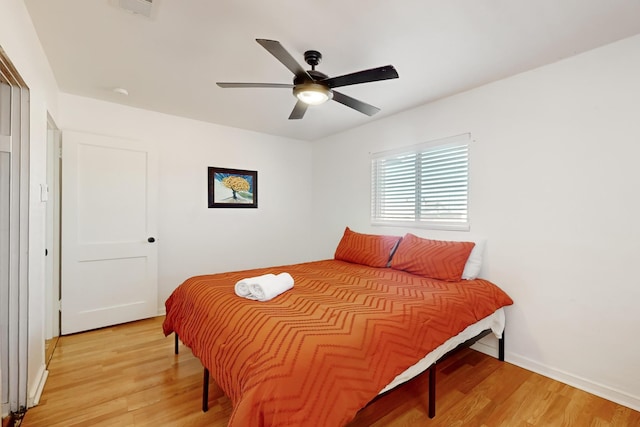 bedroom featuring light hardwood / wood-style floors and ceiling fan