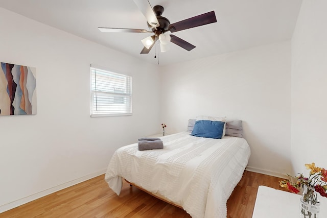 bedroom featuring hardwood / wood-style floors and ceiling fan