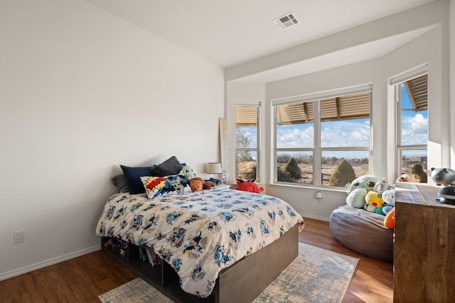 bedroom with hardwood / wood-style floors