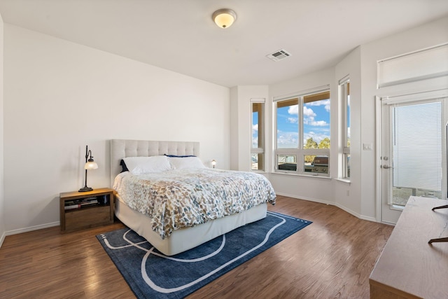 bedroom featuring dark hardwood / wood-style flooring