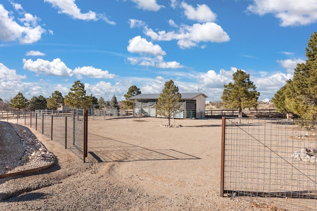 exterior space featuring a rural view and an outdoor structure