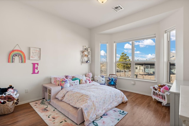 bedroom with hardwood / wood-style floors