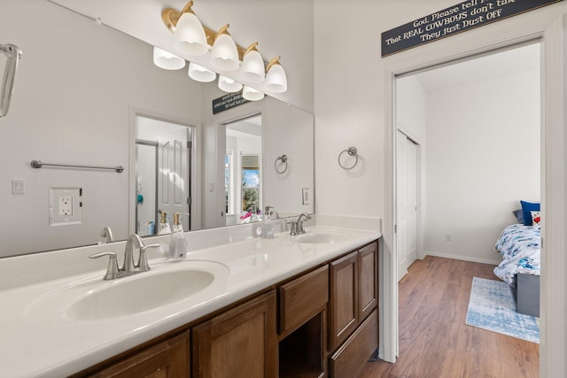 bathroom with vanity and wood-type flooring