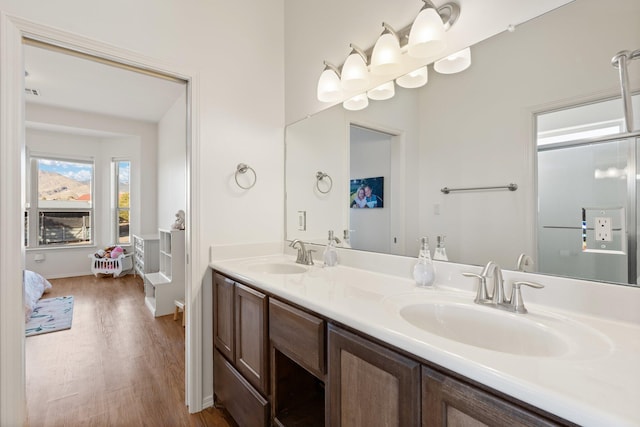 bathroom featuring vanity and hardwood / wood-style floors