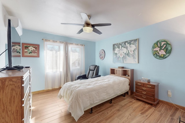 bedroom featuring light hardwood / wood-style floors and ceiling fan