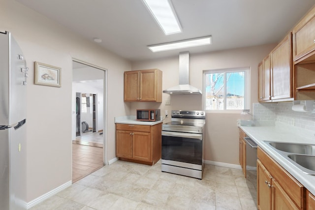 kitchen featuring wall chimney exhaust hood, stainless steel appliances, sink, and backsplash