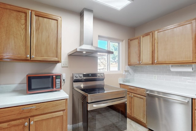 kitchen with tasteful backsplash, appliances with stainless steel finishes, and wall chimney exhaust hood