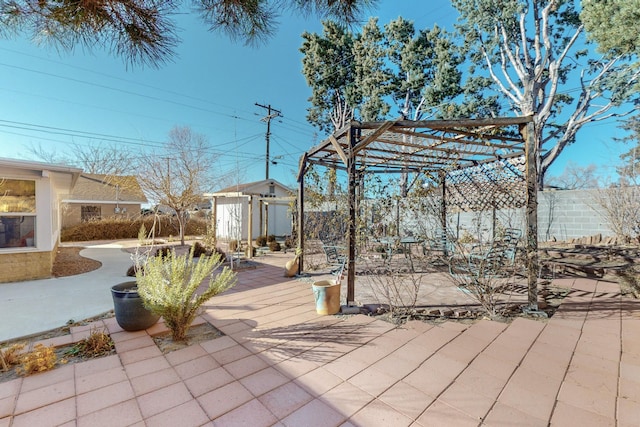 view of patio with a storage shed