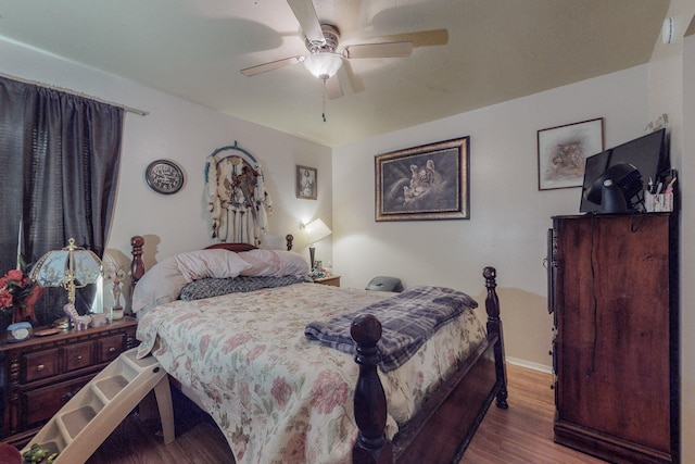 bedroom featuring wood-type flooring and ceiling fan