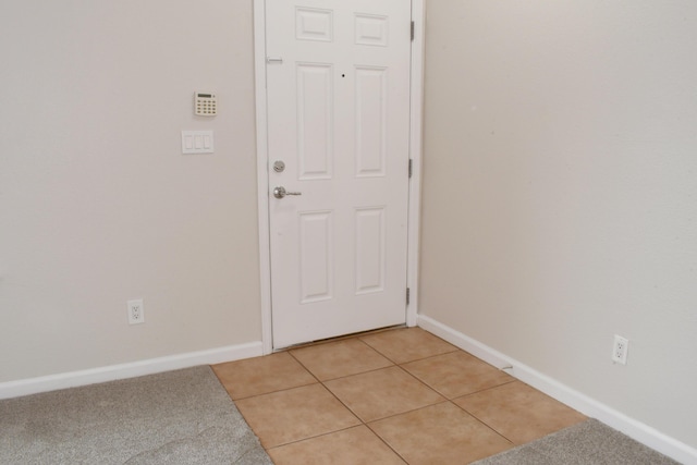 doorway featuring light tile patterned floors