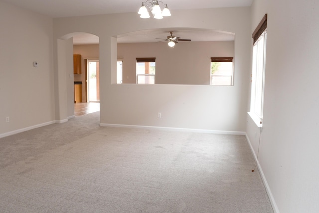 carpeted empty room featuring ceiling fan