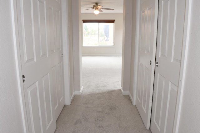 hallway with light carpet