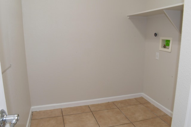 laundry room with washer hookup and tile patterned flooring