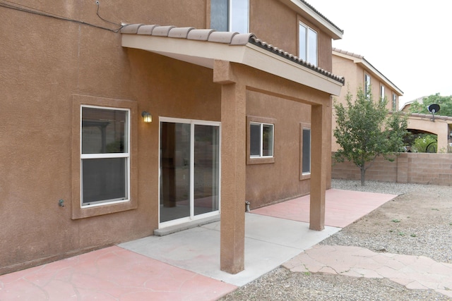 back of property featuring a patio