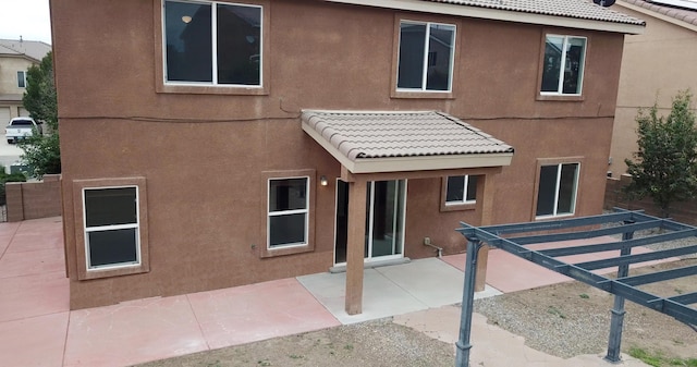 rear view of house featuring a patio area