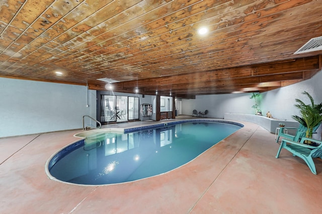 view of swimming pool with a jacuzzi