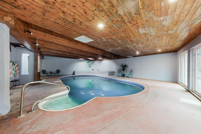 view of pool with a hot tub