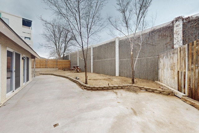 13428 Panorama Loop NE, Albuquerque, NM 87123 - fenced backyard with a patio area
