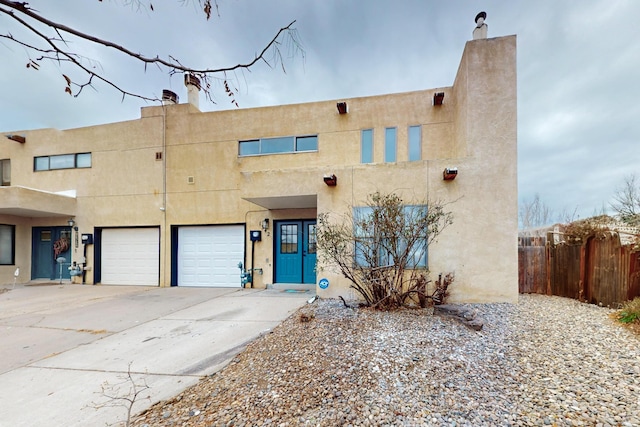 southwest-style home featuring a garage