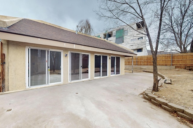 13428 Panorama Loop NE, Albuquerque, NM 87123 - rear view of house featuring a patio, a shingled roof, and stucco siding