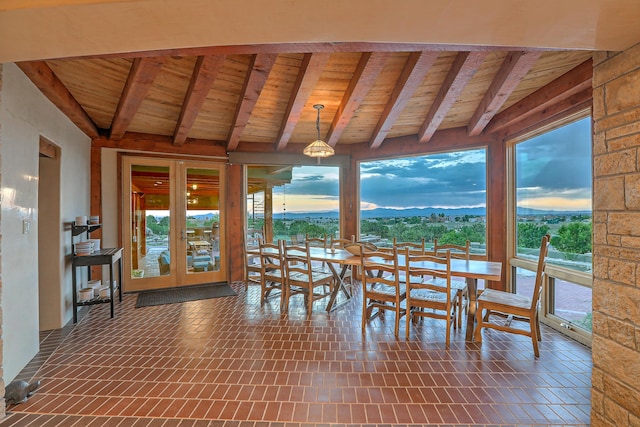 unfurnished sunroom with french doors, beam ceiling, and wooden ceiling