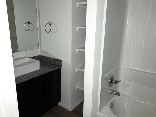 bathroom with vanity and shower / tub combination